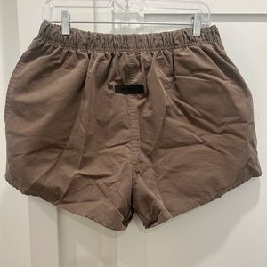 Fear of god essentials logo dock shorts color wood